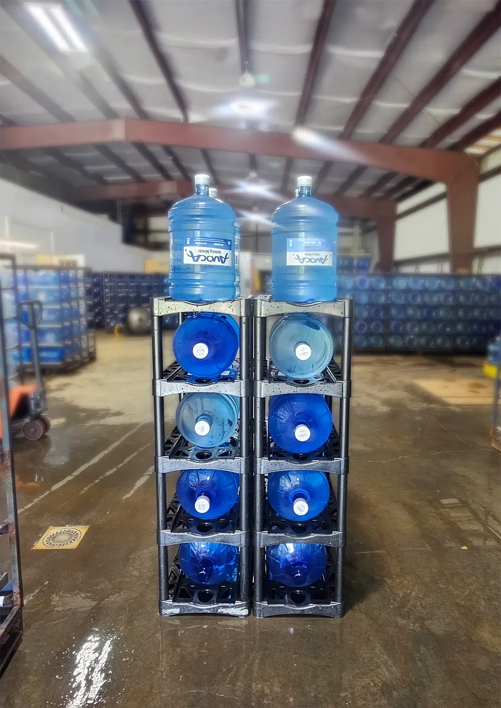 Racks of bottled Avoca Spring Water ready for delivery